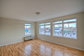 Somerset apartment for rent - Living room with several windows and AC unit attached to the wall