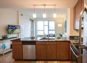St. Louis Park apartment for rent - A modern kitchen with wooden cabinets and a large island.