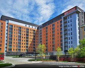 St. Louis Park apartment for rent - A multi-story building with the sign "Now Fasig" on the top.