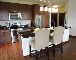 Brookfield apartment for rent - a kitchen with a island and a table with chairs