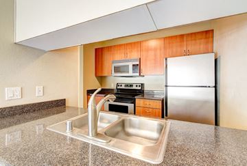 Bellevue apartment for rent - A kitchen with a sink and a refrigerator.