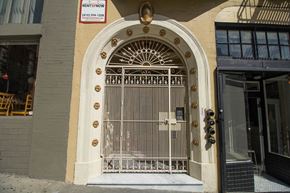 San Francisco apartment for rent - A building with a large gate and a sign that says RentFnow.
