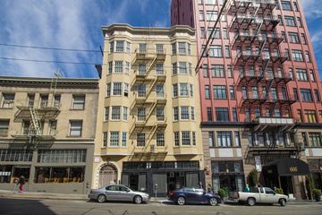 San Francisco apartment for rent - A row of buildings with cars parked in front.
