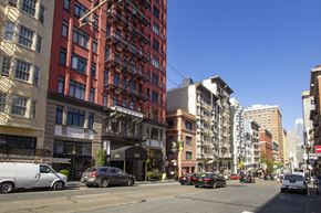 San Francisco apartment for rent - A city street with cars and buildings.