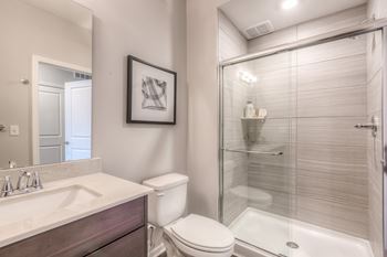 Renovated bathrooms with quartz counters