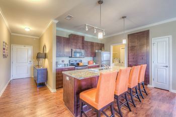 Fitted kitchen with island dining