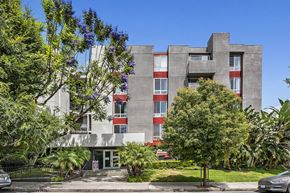 Los Angeles apartment for rent - the exterior of a building with trees in front of it