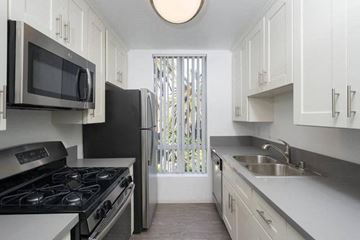 Los Angeles apartment for rent - a kitchen with a stove and a sink and a refrigerator