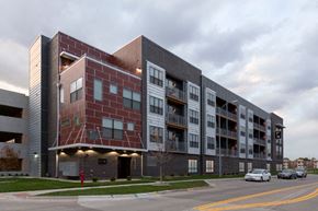 Omaha apartment for rent - an apartment building with a red brick facade on the corner of a street
