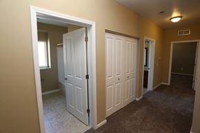 West Des Moines apartment for rent - a bedroom with two doors and a hallway with two closets