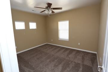 West Des Moines apartment for rent - a living room with carpet and a ceiling fan