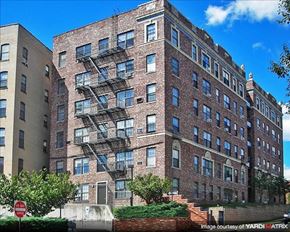Hackensack apartment for rent - A red brick building with a fire escape on the side.