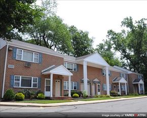 Allentown apartment for rent - A brick house with a white door and windows.
