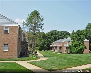 Allentown apartment for rent - A brick building with a tree in front of it.