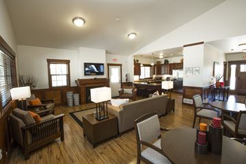 Dickinson apartment for rent - a living room with couches and chairs and a dining room and a kitchen