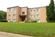 Bloomington apartment for rent - an apartment building with a green lawn in front of it