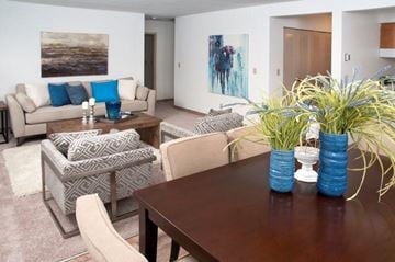 Bloomington apartment for rent - a living room with a wooden table and chairs