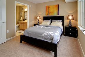 Savage townhouse for rent - a bedroom with a bed and a bathroom with a sink