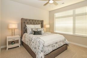 Madison apartment for rent - a bedroom with a bed and a ceiling fan