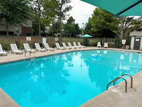 Fayetteville apartment for rent - a swimming pool with chairs and a float in it