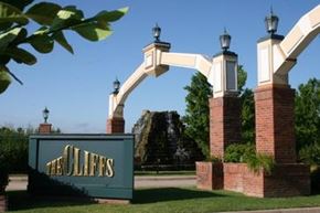 Fayetteville apartment for rent - A sign that says "The Olliffs" is in front of a brick archway.