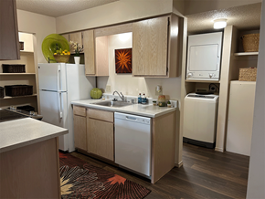 Bentonville apartment for rent - a kitchen with white appliances and a sink and a refrigerator