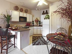 Fayetteville apartment for rent - a kitchen and dining room with a table and chairs