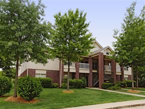 Fayetteville apartment for rent - our apartments at the district feature a spacious courtyard and green grass