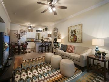 Springdale apartment for rent - a living room with a couch and a ceiling fan