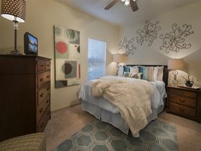 Springdale apartment for rent - a bedroom with a bed and a ceiling fan