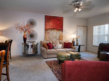 Canton apartment for rent - a living room with a couch and a ceiling fan