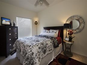 Starkville apartment for rent - a bedroom with a bed and a dresser