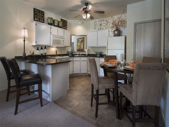 Fayetteville apartment for rent - a kitchen and dining area with a table and chairs