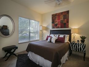Fayetteville apartment for rent - a bedroom with a bed and a window