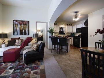 Fayetteville apartment for rent - a living room and kitchen with a couch and a table
