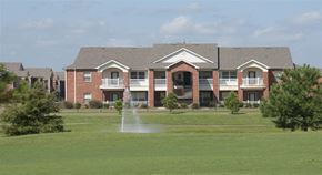 Conway apartment for rent - a fountain in the grass in front of a building