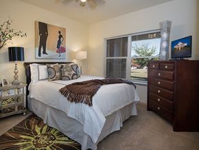 Norman apartment for rent - a bedroom with a bed and a window