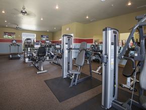 Oklahoma City apartment for rent - a gym with a lot of machines and weights