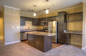 Lincoln townhouse for rent - a large kitchen with stainless steel appliances and granite counter tops