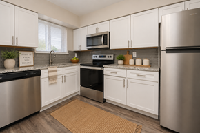 Nottingham apartment for rent - A kitchen with white cabinets and stainless steel appliances.
