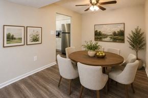 Nottingham apartment for rent - A dining room with a wooden table and chairs.