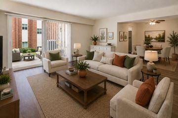 Nottingham apartment for rent - A living room with a brown rug and a white couch.