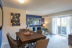 Glen Burnie apartment for rent - a dining room with a wooden table and chairs