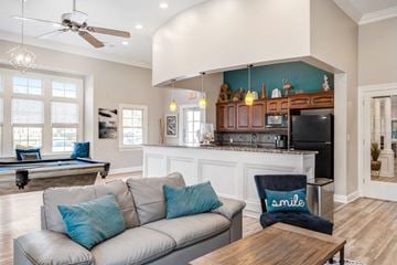 Lexington Park townhouse for rent - A living room with a grey couch and a wooden coffee table.