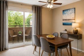 Baltimore apartment for rent - A dining room with a table set for four.