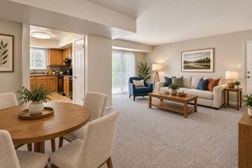 Westminster apartment for rent - A well-lit living room with a dining table and chairs.