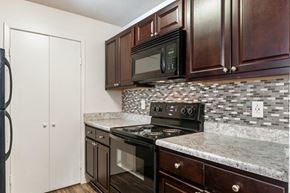 York apartment for rent - a kitchen with a stove and a microwave