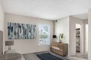York apartment for rent - a bedroom with a dresser and a painting on the wall