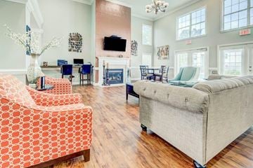 Lexington apartment for rent - a living room with couches and chairs and a fireplace