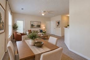 Lexington apartment for rent - A dining room with a wooden table and chairs.